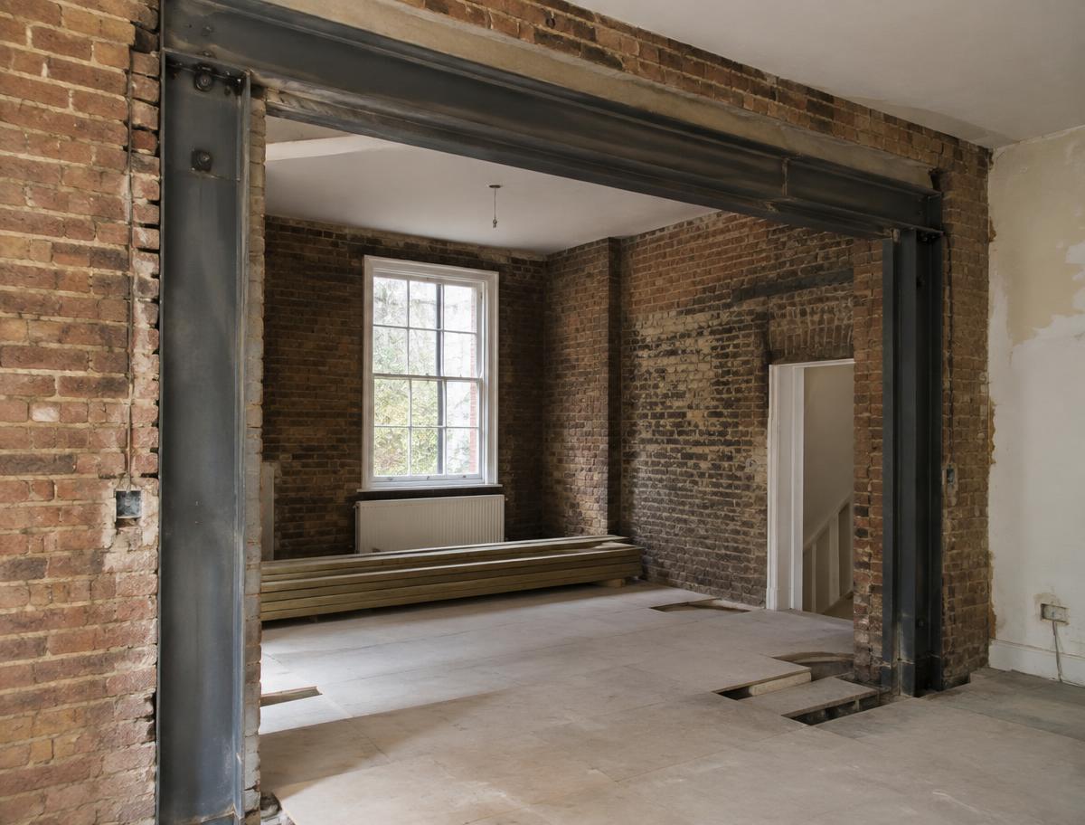 Steel beam frame supporting a structural opening in a London house